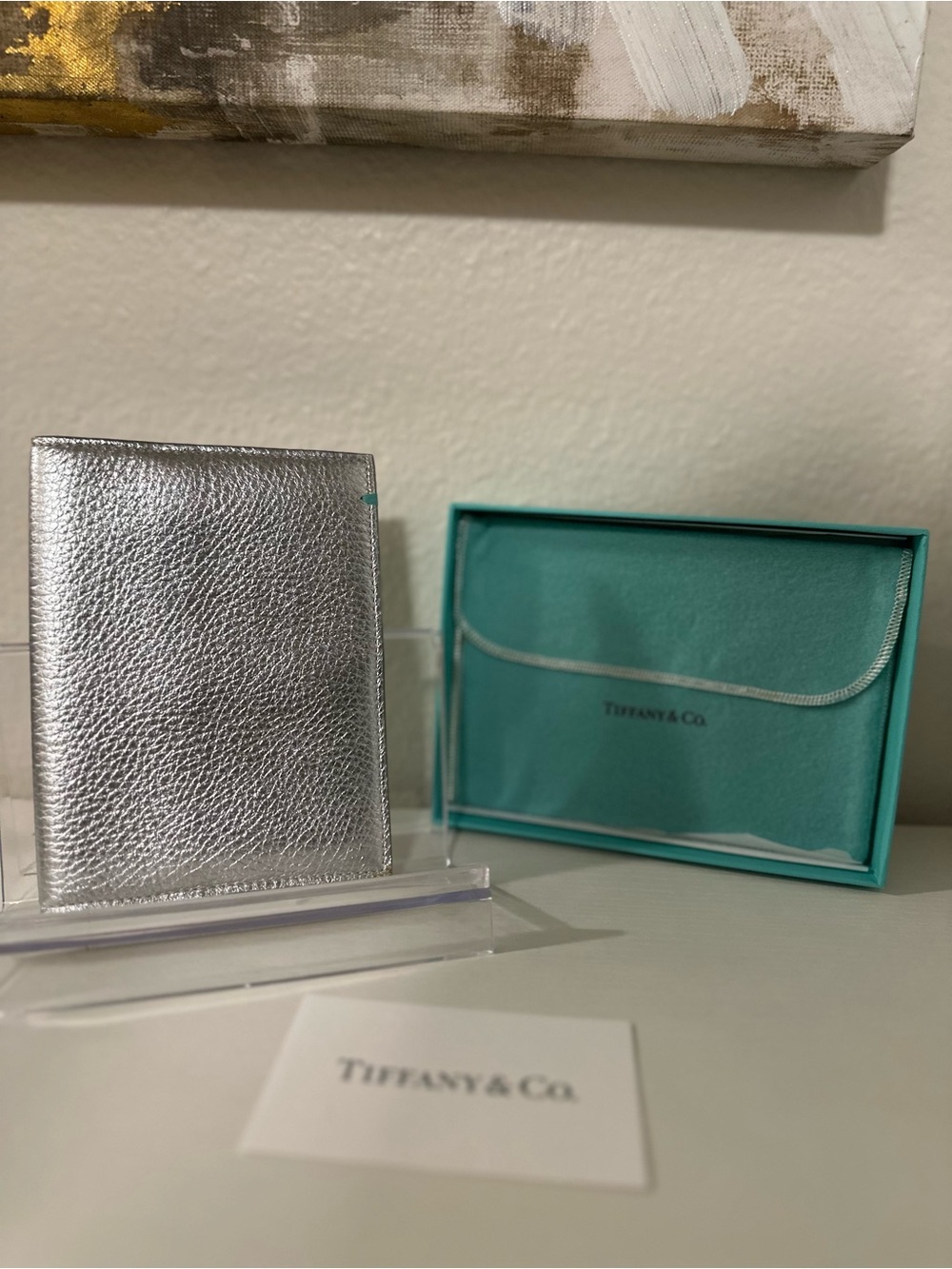 TIFFANY & Co. silver leather passport holder.